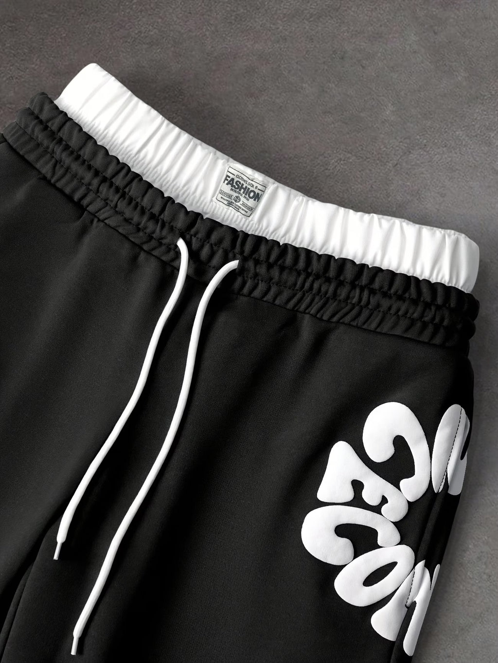 Loose-fitting sweatpants with letter print and drawstring waist