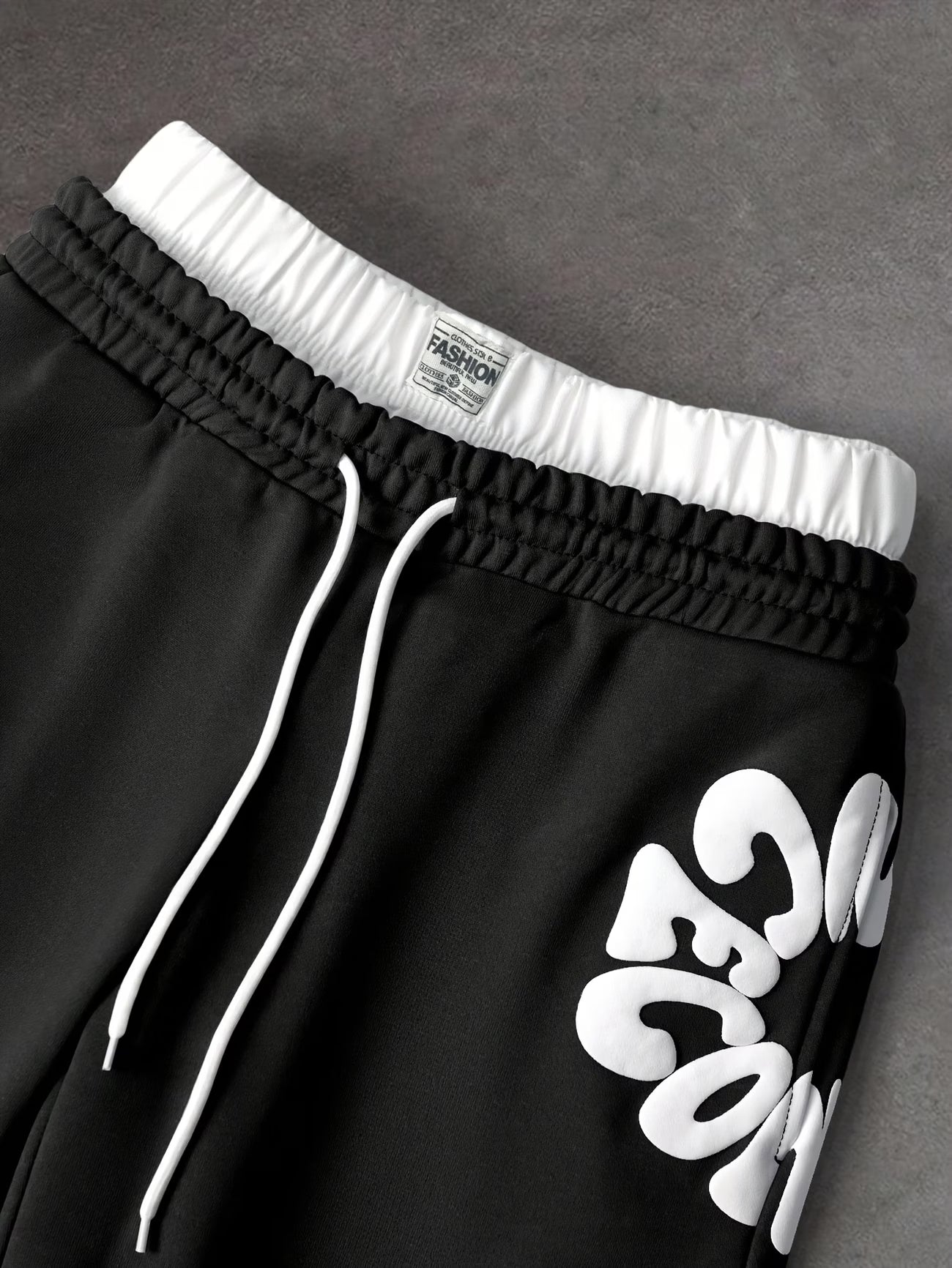 Loose-fitting sweatpants with letter print and drawstring waist