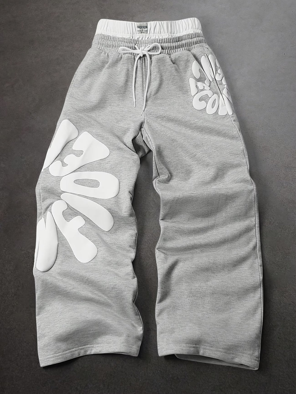 Loose-fitting sweatpants with letter print and drawstring waist