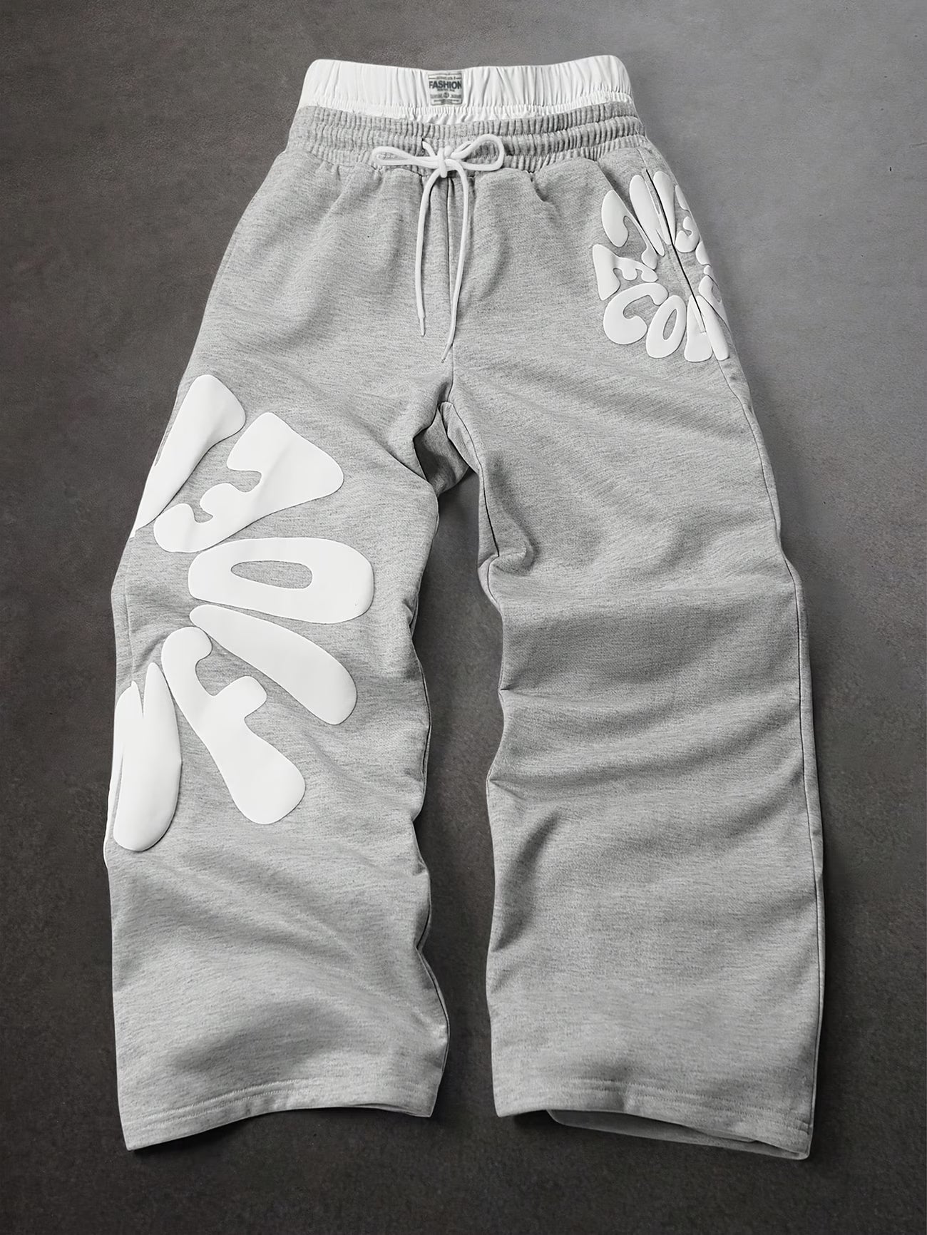 Loose-fitting sweatpants with letter print and drawstring waist