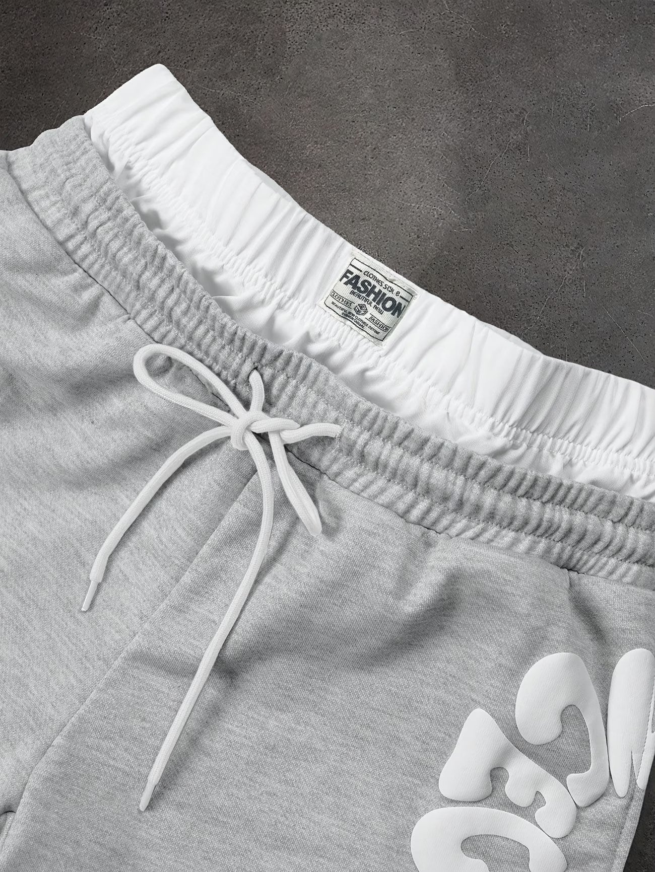 Loose-fitting sweatpants with letter print and drawstring waist